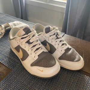 Nike White and Gray Sneakers with Gold Accents